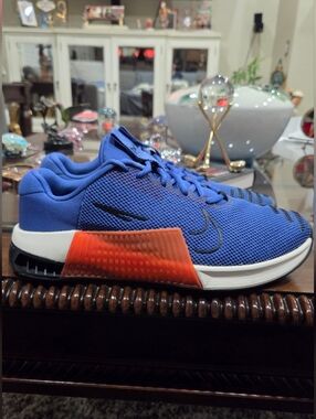 Nike Men’s Blue Running Shoes with Orange Accent